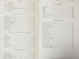 an open book with a list of items on it sitting on top of a table