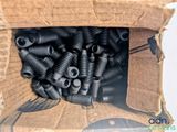 a cardboard box with a bunch of screws inside of it