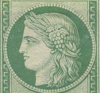 un timbre vert avec la tête d'une femme au centre