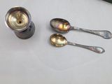 three spoons and a canister on a table