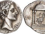a silver coin with an image of a woman holding a cage