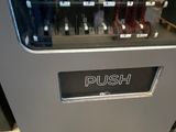 a machine that has a bunch of bottles in it