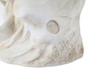 a statue of a man with a hat on his head