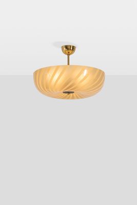 a close up of a light fixture on a white wall