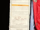 an image of a red jacket with a label on it