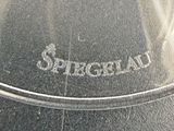 a close up of a glass vase with a name etched on it