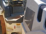 a picture of a tractor with a seat and a back end
