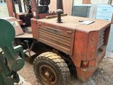 a tractor that is sitting in the dirt