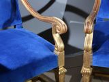 two blue chairs that are sitting next to each other