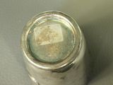 a close up of a silver object on a table