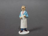 a figurine of a man in a chef ' s uniform