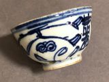 a small blue and white bowl on a table