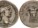 a silver coin with an image of a woman wearing a headdress
