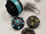 a toy blow dryer sitting on a table next to some buttons