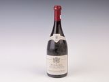 a bottle of wine that is sitting on a table