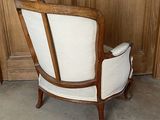 a chair that is sitting in front of a wooden wall