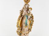 a statue of the virgin mary holding a child in her arms