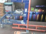 a picture of a fork lifter sitting in a garage