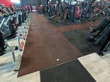 a large gym with a lot of machines in it