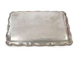 an antique silver tray on a white background with a red handle
