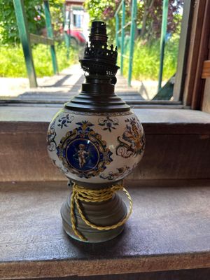 a lamp that is sitting on a window sill