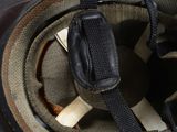 a close up of a helmet with a cell phone in it