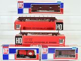 three red and blue train cars are stacked on top of each other