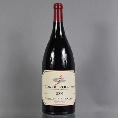 a close up of a bottle of red wine on a table