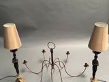 two lamps that are on a table with a white background