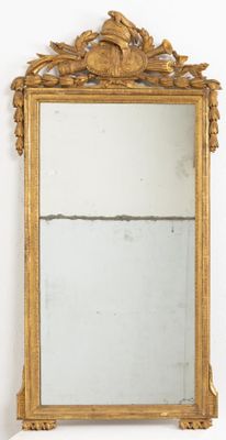 a mirror that is sitting on the wall in the room
