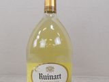 a bottle of wine that is sitting on a table