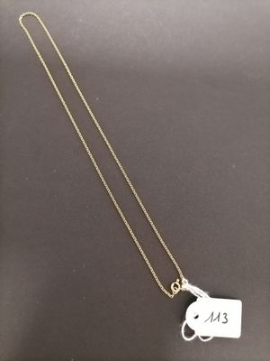 a necklace with a tag that says e k on it