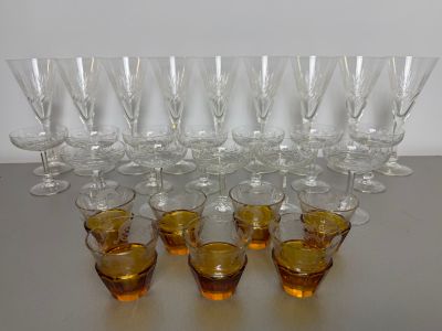 a lot of glasses that are sitting on a table
