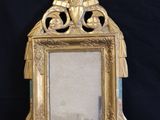 a picture of a gold picture frame on a black background