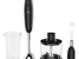 a blender with a glass cup and a whisk in front of it