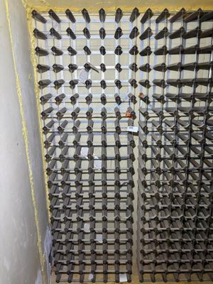 a picture of a wine rack in a wine cellar