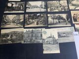 several old black and white photographs of buildings and buildings on a table