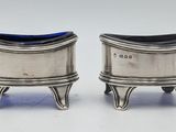 pair of silverplated salt and pepper shakers on stands