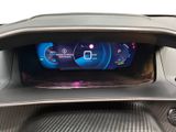 the dashboard of a car with a digital display in the center