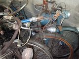 many old bikes that are parked in a garage