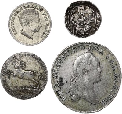 four different types of silver coins on a white background