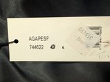 the label of a black jacket with a white tag on it
