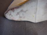 a close up of a surfboard on the ground