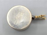 an image of a close up of a coin on a white surface