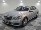 a picture of a silver mercedes s - class in a showroom