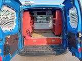 a blue van with a red seat and back door open