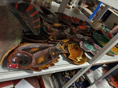 a shelf with a lot of decorative items on it