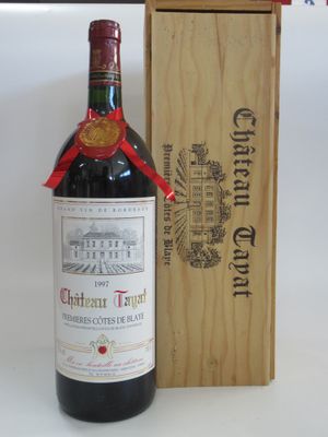 a bottle of wine sitting next to a wooden box