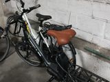 two bikes parked next to each other in a garage