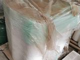 a pallet of plastic wrapped up on a pallet in a warehouse